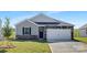 Modern craftsman style home with gray siding and stone accents at 219 Brinkley Dr # 98, Kings Mountain, NC 28086