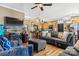 Comfortable living room with gray sectional, fireplace, and views into the kitchen at 1000 Creekside Dr, Lincolnton, NC 28092