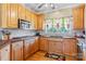 Bright kitchen with wood cabinets, butcher block countertops and gas range at 1000 Creekside Dr, Lincolnton, NC 28092