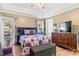 Spacious bedroom with a comfortable bed, dresser, and access to a private patio at 1000 Creekside Dr, Lincolnton, NC 28092