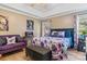 Bright bedroom featuring a plush bed, sitting area, and ample natural light at 1000 Creekside Dr, Lincolnton, NC 28092