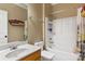 Simple bathroom with a single sink, shower/tub combo, and linen storage at 1000 Creekside Dr, Lincolnton, NC 28092