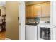 Convenient laundry room with washer, dryer, and ample cabinet storage at 1000 Creekside Dr, Lincolnton, NC 28092