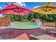 Relaxing above ground pool with deck and patio umbrellas at 1000 Creekside Dr, Lincolnton, NC 28092