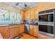 Kitchen features wood cabinets, double oven and spacious countertops at 1000 Creekside Dr, Lincolnton, NC 28092