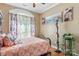 Charming bedroom with a full-size bed, unique decor, and an arched window at 1000 Creekside Dr, Lincolnton, NC 28092
