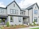 Modern two story home with gray and white exterior, and landscaping at 135 Armstrong Rd, Belmont, NC 28012