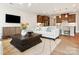 Spacious living room with hardwood floors, large windows, and open floor plan at 135 Armstrong Rd, Belmont, NC 28012