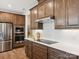 Modern kitchen with stainless steel appliances and white herringbone backsplash at 135 Armstrong Rd, Belmont, NC 28012