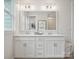 Double vanity bathroom with white cabinets and large mirror at 135 Armstrong Rd, Belmont, NC 28012
