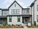 Modern two-story home with gray and white exterior and landscaped yard at 135 Armstrong Rd, Belmont, NC 28012