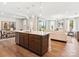 Open concept kitchen with island and stainless steel appliances, overlooking living room at 135 Armstrong Rd, Belmont, NC 28012