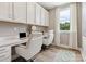 Home office with two workstations, built-in cabinets, and a window with natural light at 135 Armstrong Rd, Belmont, NC 28012