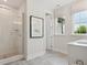 Bathroom with a walk-in shower and stylish gray tile floors at 135 Armstrong Rd, Belmont, NC 28012
