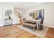 Bright dining room with hardwood floors, a farmhouse table, and stylish wall art at 135 Armstrong Rd, Belmont, NC 28012