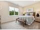 Bedroom with a queen-size bed and wood bench at 135 Armstrong Rd, Belmont, NC 28012