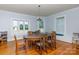 Bright dining room with built-in window seat and hardwood floors at 243 Love St, McConnells, SC 29726