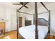 Spacious bedroom with a wooden four-poster bed and hardwood floors at 243 Love St, McConnells, SC 29726