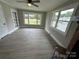 Sun-drenched living area with large windows and hardwood floors at 12 Rosedale Dr, Concord, NC 28027