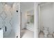 Modern bathroom with double vanity, walk-in shower, and separate toilet at 1529 Beckwith Pl, Charlotte, NC 28205