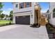 Dark gray double garage door with a wooden staircase to the second floor at 1529 Beckwith Pl, Charlotte, NC 28205