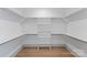 Large walk-in closet with ample hanging space and shelving at 1529 Beckwith Pl, Charlotte, NC 28205