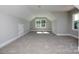 Spacious bonus room with neutral carpet and two windows at 00 Rivendell Rd # 7, Denver, NC 28037