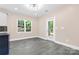 Dining area with door leading to backyard; features neutral walls and flooring at 4426 Pine St # 74, Kannapolis, NC 28081