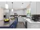Modern kitchen with gray cabinets, an island, and stainless steel appliances at 4426 Pine St # 74, Kannapolis, NC 28081
