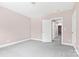 Simple bedroom with grey carpet and neutral walls at 4426 Pine St # 74, Kannapolis, NC 28081