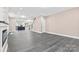Spacious living area with grey wood-look flooring, leading to kitchen and stairs at 4426 Pine St # 74, Kannapolis, NC 28081