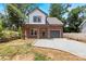 Brick two-story home with a gray door and attached garage at 4426 Pine St # 74, Kannapolis, NC 28081