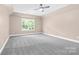 Simple bedroom with grey carpet and large window at 4426 Pine St # 74, Kannapolis, NC 28081