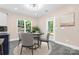Bright dining area with a table and chairs near the back door at 4426 Pine St # 74, Kannapolis, NC 28081