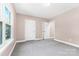 Well-lit bedroom with neutral walls, carpet flooring, and two closets at 4426 Pine St # 74, Kannapolis, NC 28081