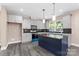Modern kitchen with gray cabinets, a large island, and stainless steel appliances at 4426 Pine St # 74, Kannapolis, NC 28081
