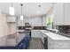 Modern kitchen with gray cabinets, an island, and stainless steel appliances at 4426 Pine St # 74, Kannapolis, NC 28081