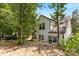 White house exterior with black accents nestled amongst trees at 4426 Pine St # 74, Kannapolis, NC 28081