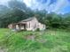 Older fixer-upper home with a porch and needs significant renovations at 303 Ray St, Lancaster, SC 29720