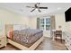 Main bedroom with queen bed, desk and ceiling fan at 919 Edgemont Ave, Belmont, NC 28012