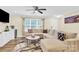 Living room with sectional sofa, fireplace and large TV at 919 Edgemont Ave, Belmont, NC 28012
