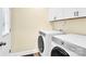 Bright laundry room with side-by-side washer and dryer at 919 Edgemont Ave, Belmont, NC 28012