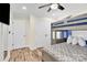 Well-lit bedroom featuring a bunk bed, double doors, and plenty of closet space at 919 Edgemont Ave, Belmont, NC 28012