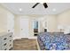 Main bedroom with dresser, large bed, and en suite bath at 919 Edgemont Ave, Belmont, NC 28012