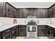 Modern kitchen with stainless steel appliances and white backsplash at 919 Edgemont Ave, Belmont, NC 28012
