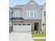 Modern 2-story townhouse with attached garage and stone accents at 10619 Audubon Ridge Dr # 24, Cornelius, NC 28031
