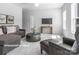 Spacious living room with comfortable seating and large TV at 10619 Audubon Ridge Dr # 24, Cornelius, NC 28031