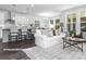 Open kitchen with white cabinets, granite counters, and island at 10619 Audubon Ridge Dr # 24, Cornelius, NC 28031
