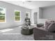 Bright living room featuring a sectional sofa and large windows at 10619 Audubon Ridge Dr # 24, Cornelius, NC 28031