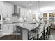 Modern kitchen with white cabinets, large island, and stainless steel appliances at 10619 Audubon Ridge Dr # 24, Cornelius, NC 28031